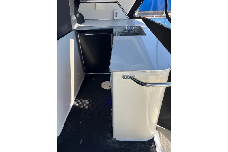Slide: The Image of Compact kitchenette on 1987 Californian 44 Veneti yacht with sink and counter. - 10