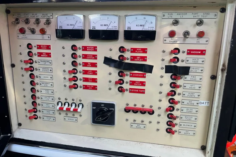 Slide: The Image of Electrical control panel of a 1987 Californian 44 Veneti boat with switches and gauges. - 12