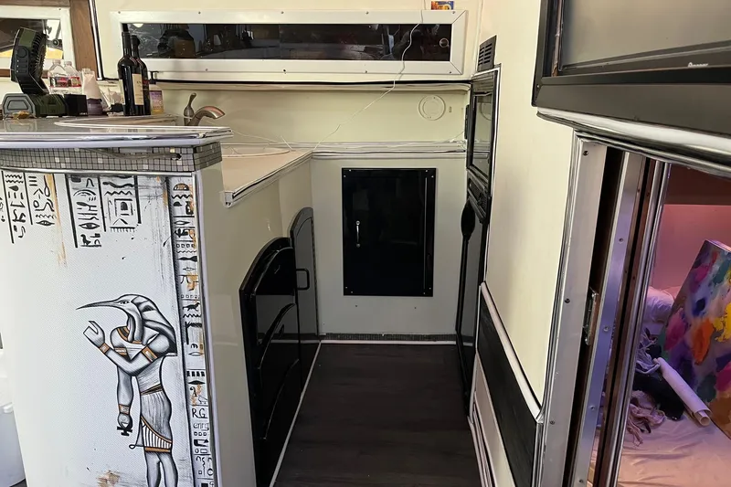 Slide: The Image of Interior of a 1987 Californian 44 Veneti RV with Egyptian-themed decor. - 15