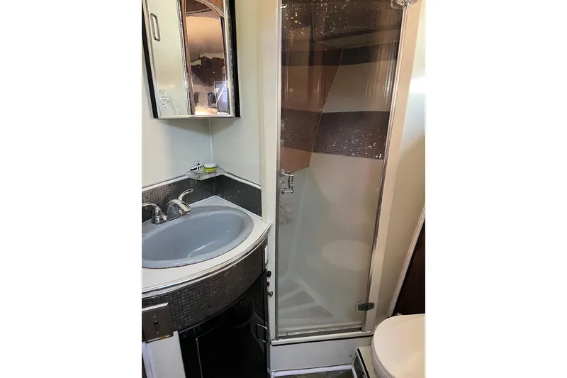 Slide: The Image of Compact bathroom in 1987 Californian 44 Veneti yacht with shower and sink. - 16