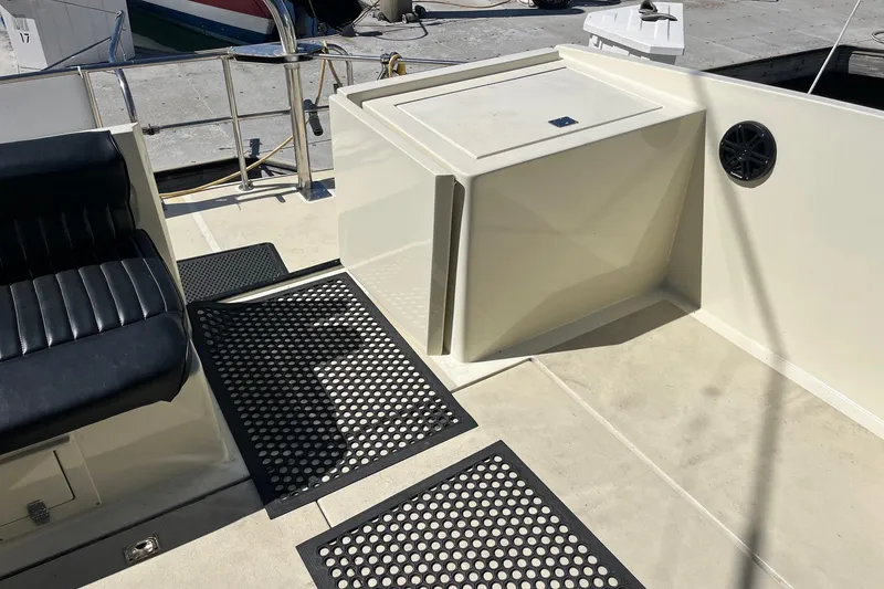 Slide: The Image of 1987 Californian 44 Veneti boat deck with seating and storage, featuring non-slip mats. - 21