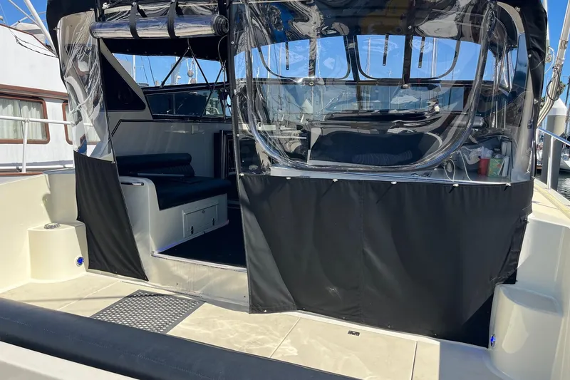 Slide: The Image of 1987 Californian 44 Veneti yacht with covered cockpit and seating area. - 7