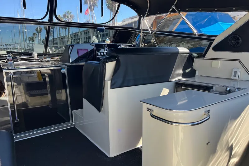 Slide: The Image of Interior of 1987 Californian 44 Veneti yacht with modern helm and seating area. - 8