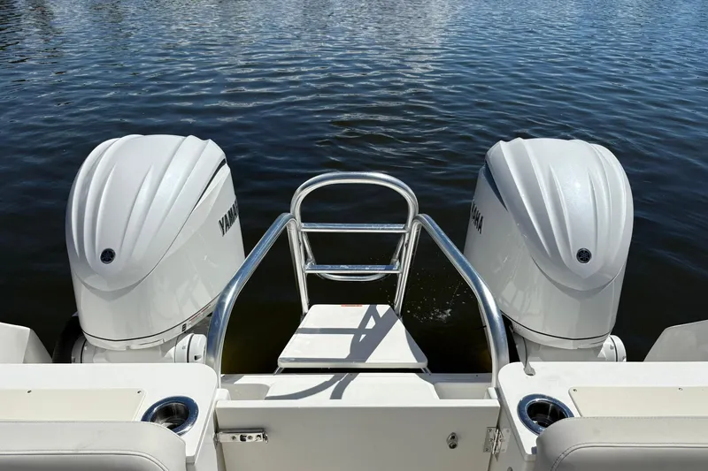 Slide: The Image of 2026 World Cat 296 DC boat with dual Yamaha outboard engines on water. - 4