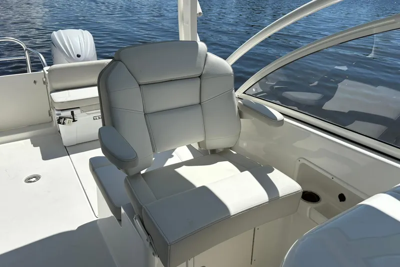Slide: The Image of Luxury seating on 2026 World Cat 296 DC boat, with water view. - 9