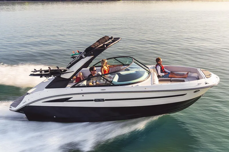 The Image of 2026 Sea Ray SDX 230 boat displayed indoors on a trailer. - 0