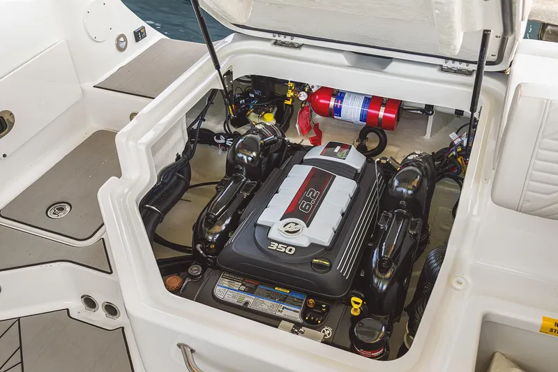 Slide: The Image of 2026 Sea Ray SDX 230 boat interior with modern seating and steering console. - 10