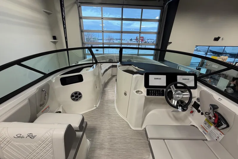 Slide: The Image of Interior view of 2026 Sea Ray SDX 230 boat with modern dashboard and seating. - 17