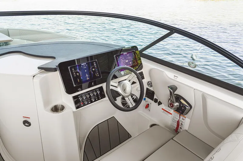 Slide: The Image of 2026 Sea Ray SDX 230 boat displayed indoors, featuring sleek design and modern amenities. - 5