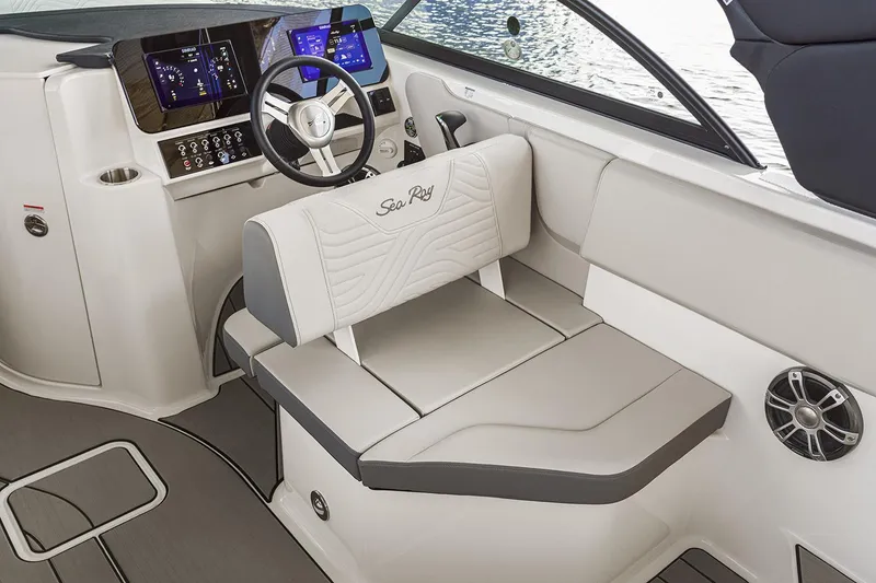 Slide: The Image of 2026 Sea Ray SDX 230 boat displayed in a showroom with reflective surfaces. - 6