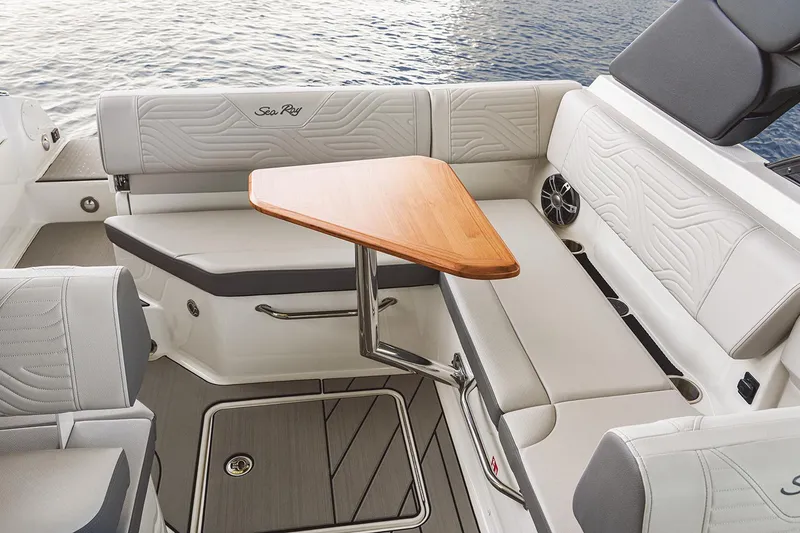 Slide: The Image of 2026 Sea Ray SDX 230 boat interior with luxurious seating and modern dashboard. - 9