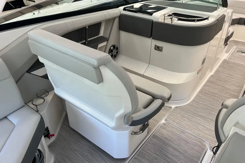 Slide: The Image of 2024 Sea Ray SLX 310 boat interior with modern seating and sleek design. - 14