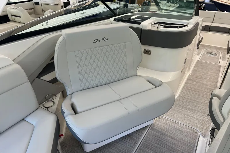 Slide: The Image of 2024 Sea Ray SLX 310 boat interior with luxurious seating and modern design. - 15