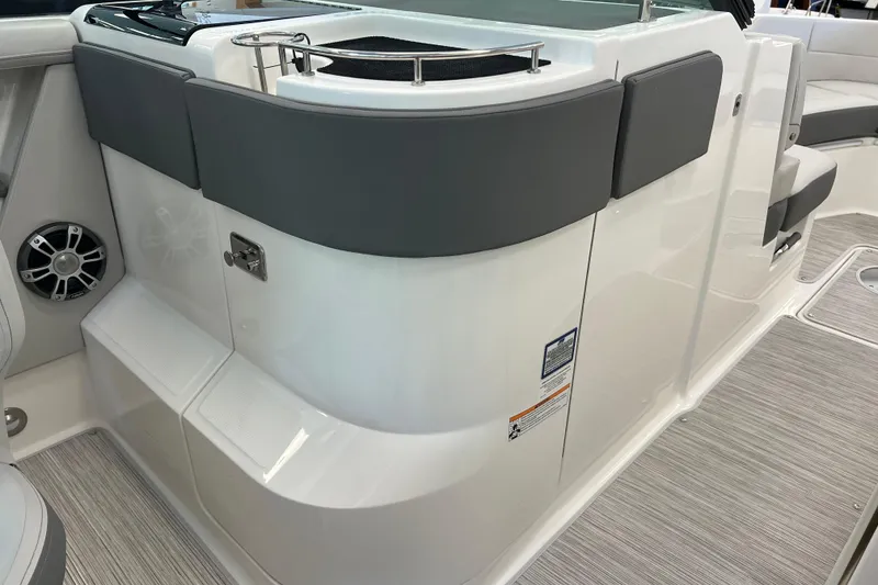 Slide: The Image of 2024 Sea Ray SLX 310 boat interior with seating and speaker system. - 19