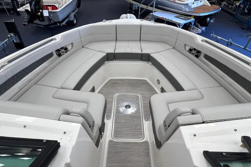 Slide: The Image of Luxurious seating area on 2024 Sea Ray SLX 310 boat, featuring elegant design and spacious layout. - 21