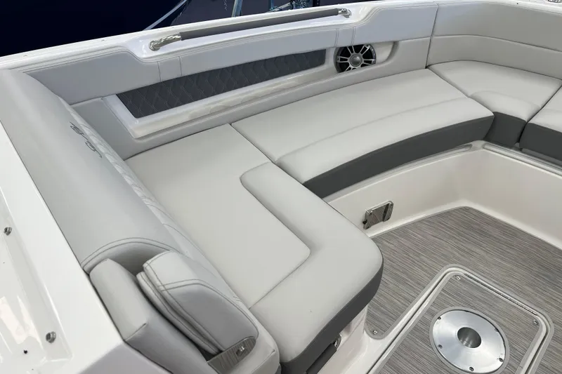 Slide: The Image of Luxurious seating area on 2024 Sea Ray SLX 310 boat, featuring elegant upholstery and modern design. - 22