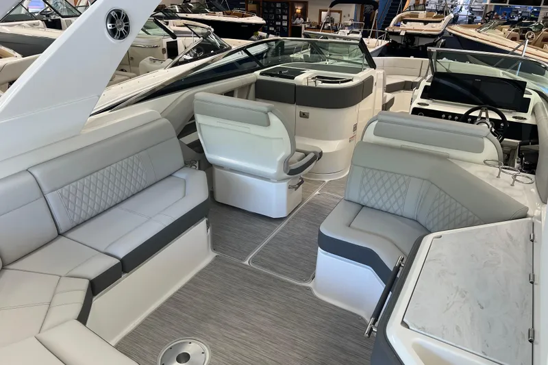 Slide: The Image of 2024 Sea Ray SLX 310 boat interior with luxurious seating and modern design. - 9