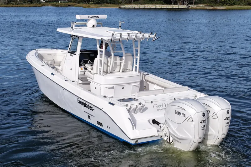 Slide: The Image of 2020 Everglades 335 Center Console boat with twin Yamaha 425 engines on water. - 10