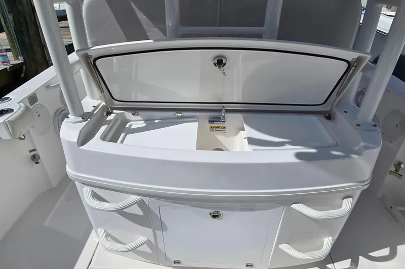 Slide: The Image of 2020 Everglades 335 Center Console boat with open storage compartment and sink. - 29