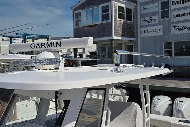 Slide: The Image of 2020 Everglades 335 Center Console boat with Garmin radar at a marina. - 40