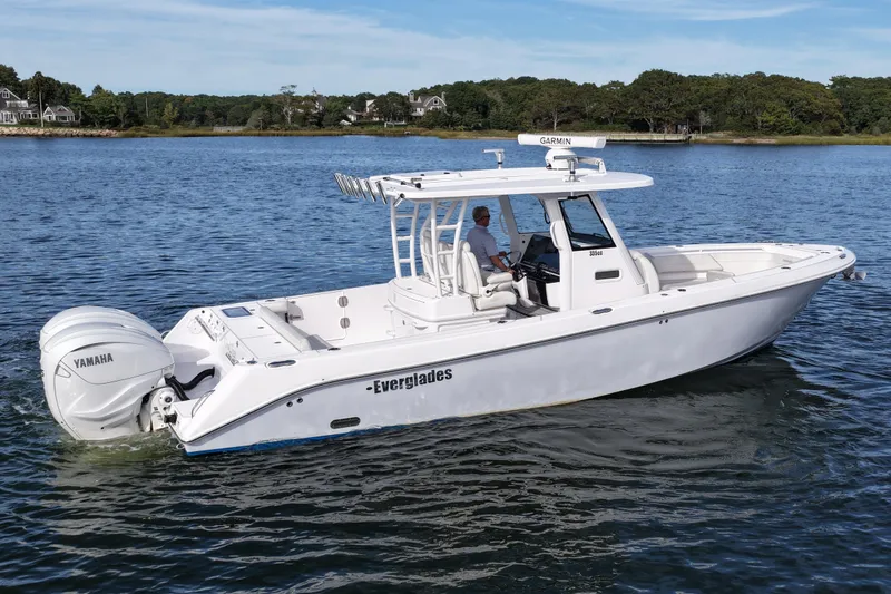 Slide: The Image of 2020 Everglades 335 Center Console boat on calm water, featuring Yamaha engines. - 7