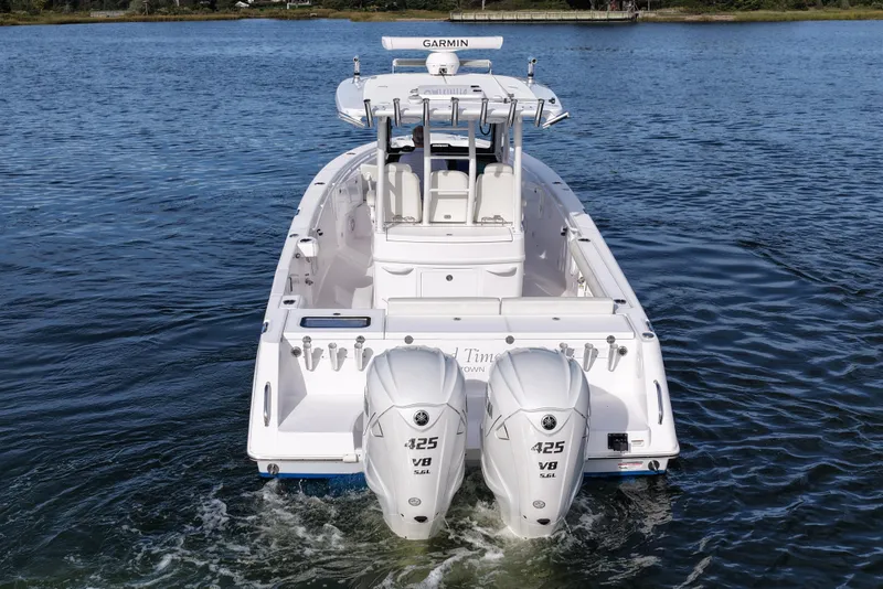Slide: The Image of 2020 Everglades 335 Center Console boat with twin 425 V8 engines on water. - 9