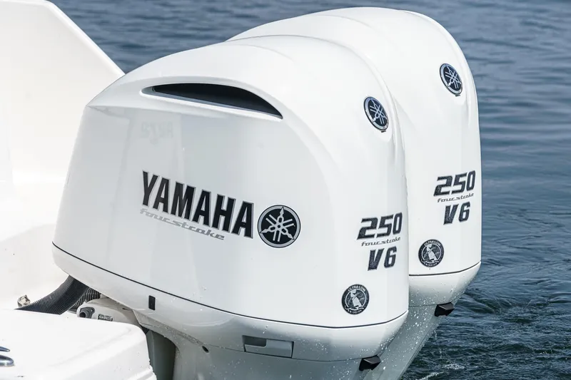 Slide: The Image of Twin Yamaha 250 V6 outboard engines on a 2020 Robalo R272 Center Console boat. - 11