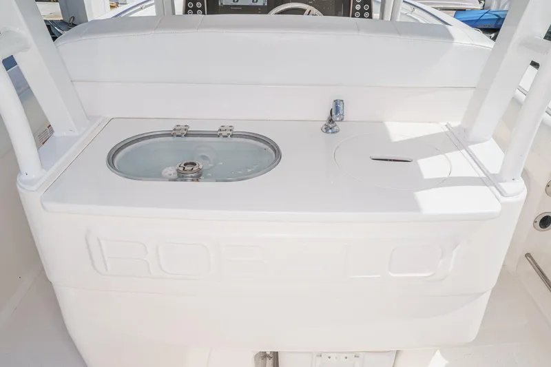 Slide: The Image of 2020 Robalo R272 Center Console boat with livewell and sink station. - 19