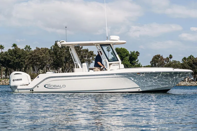 Slide: The Image of 2020 Robalo R272 Center Console boat on water, featuring Yamaha engine. - 4
