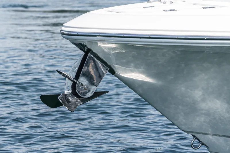 Slide: The Image of 2020 Robalo R272 Center Console boat with anchor over water. - 7