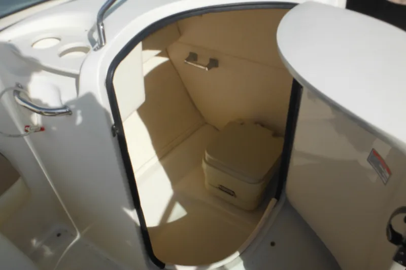 Slide: The Image of Interior view of 2005 Sea Ray 220 Sundeck boat's compact restroom area. - 25