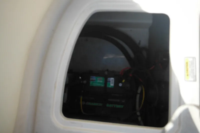 Slide: The Image of Battery compartment of a 2005 Sea Ray 220 Sundeck boat. - 26