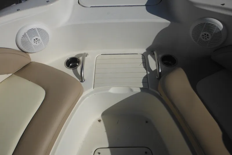 Slide: The Image of Interior of 2005 Sea Ray 220 Sundeck boat with seating and speakers. - 36