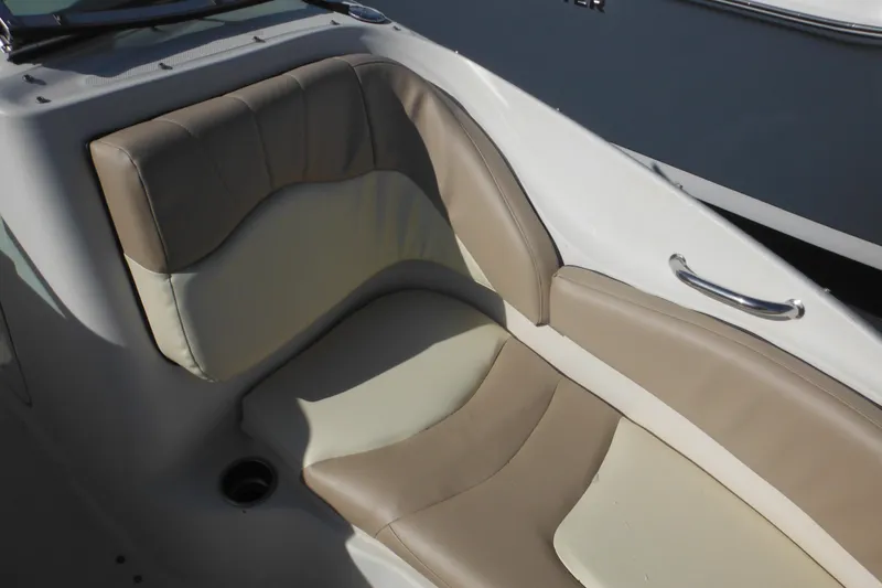 Slide: The Image of 2005 Sea Ray 220 Sundeck interior seating with beige and cream upholstery. - 39