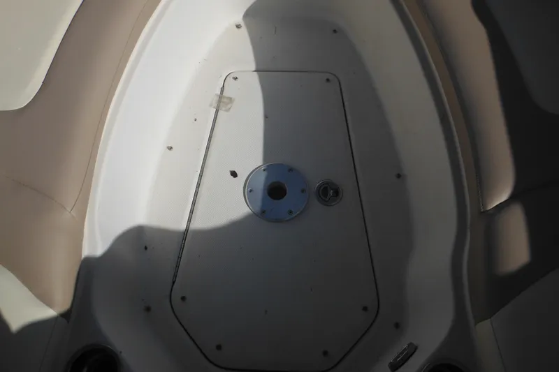 Slide: The Image of Interior view of 2005 Sea Ray 220 Sundeck boat, featuring seating and deck details. - 42