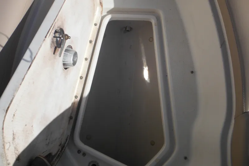 Slide: The Image of Storage compartment of a 2005 Sea Ray 220 Sundeck boat, showing interior details. - 43