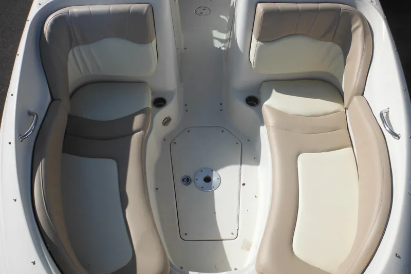 Slide: The Image of 2005 Sea Ray 220 Sundeck boat interior with beige and white seating. - 44