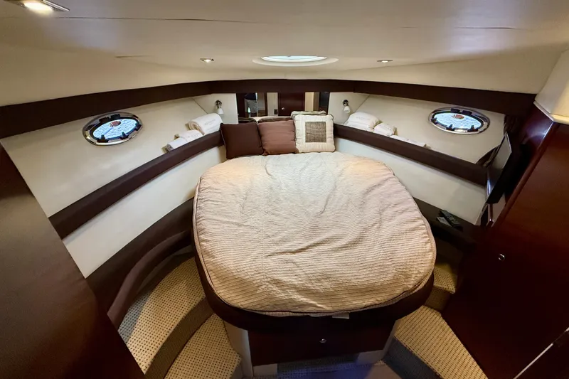 Slide: The Image of Luxurious 2011 Meridian 341 Sedan cabin with cozy bed and elegant wood accents. - 14