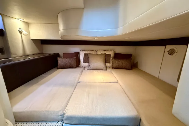 Slide: The Image of 2011 Meridian 341 Sedan interior cabin with cozy bedding and cushions. - 19