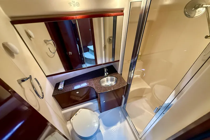 Slide: The Image of Luxurious bathroom in 2011 Meridian 341 Sedan yacht with shower, sink, and toilet. - 20