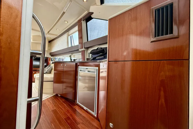 Slide: The Image of Luxurious interior of 2011 Meridian 341 Sedan yacht with polished wood finishes. - 21
