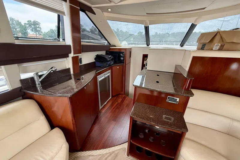 Slide: The Image of Luxurious interior of 2011 Meridian 341 Sedan yacht with kitchenette and seating area. - 22