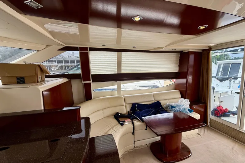 Slide: The Image of Luxurious interior of 2011 Meridian 341 Sedan yacht with leather seating and wooden accents. - 23