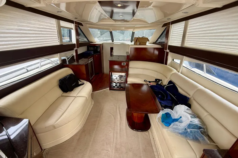 Slide: The Image of Luxurious interior of a 2011 Meridian 341 Sedan yacht with cream leather seating. - 26