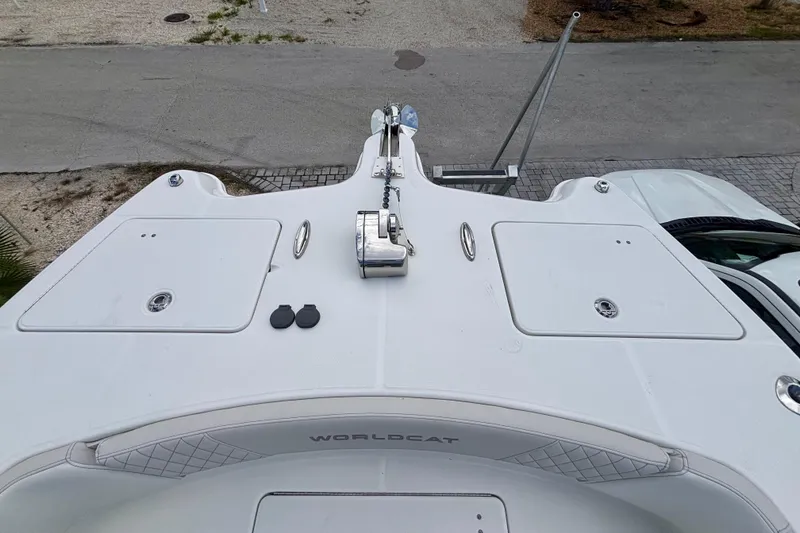 Slide: The Image of 2024 World Cat 325 CC boat deck with anchor and storage compartments. - 17