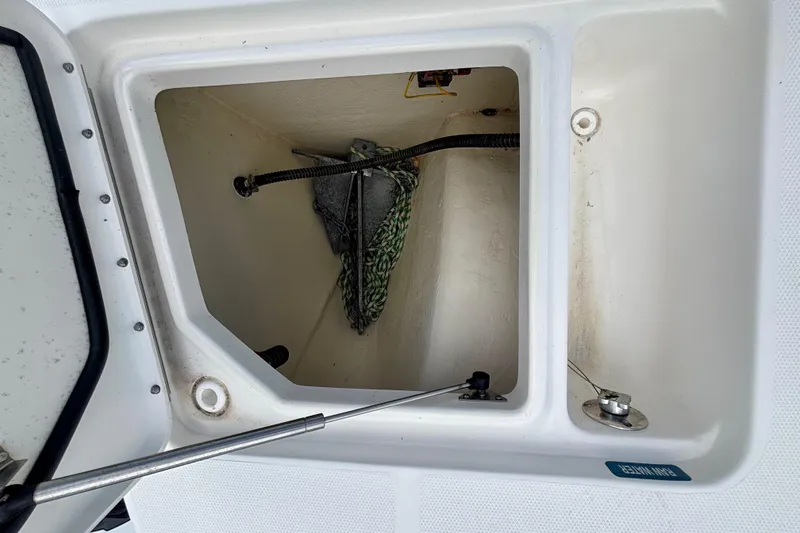 Slide: The Image of Anchor storage compartment on a 2024 World Cat 325 CC boat. - 18