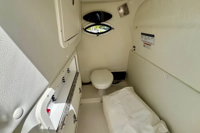 Slide: The Image of 2024 World Cat 325 CC cabin interior with toilet and storage compartments. - 35