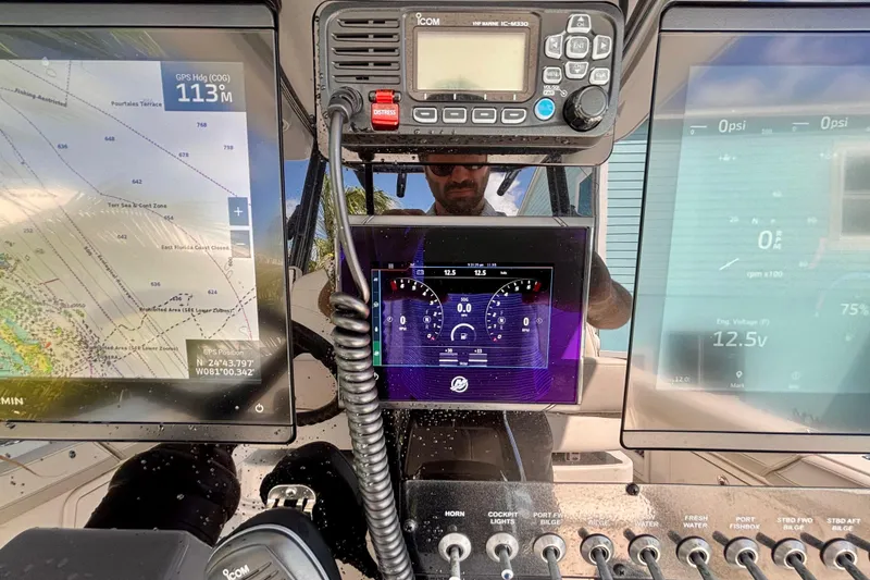 Slide: The Image of Dashboard of 2024 World Cat 325 CC boat with navigation and control systems. - 39