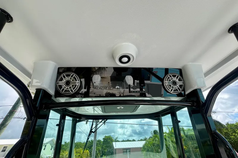 Slide: The Image of 2024 World Cat 325 CC boat interior with speakers and control panel. - 44