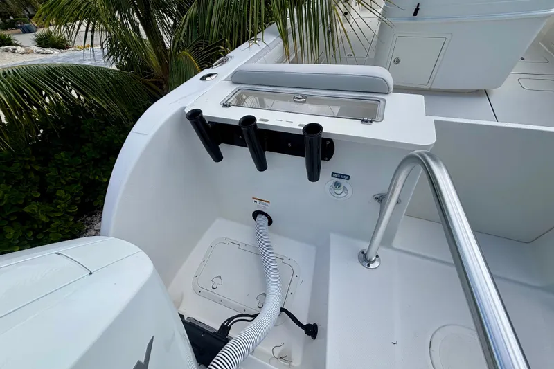 Slide: The Image of 2024 World Cat 325 CC boat deck with rod holders and fresh water access. - 62